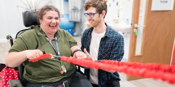 Gloucestershire House Supported Living resident Kay Torres and physiotherapist Piers Baker