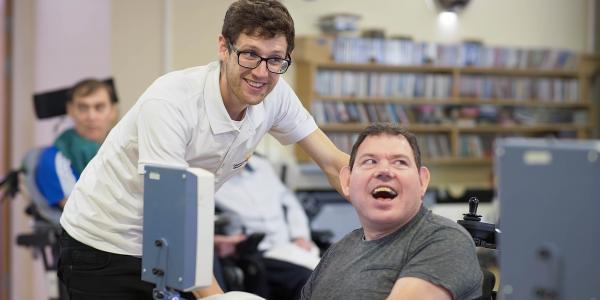 Gloucestershire House physio Piers Baker with resident Stevie Harmer