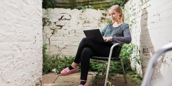 Grace, Change 100 intern, working from her garden