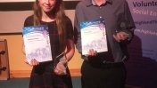 Ross and Maddie with their volunteering awards