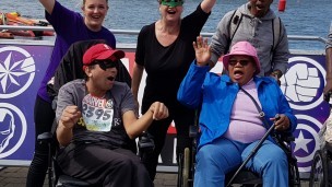 A group of residents from Randall Close celebrate at the finishing line