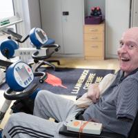 Resident on a exercise bike at Llanhennock lodge