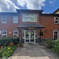 Front entrance of Fryers House Care Home with white double doors