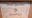 An old painting label on picture stating ' David Messum fine art dealers Beaconsfield'