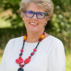 Baker Pru Leith smiling directly at the camera