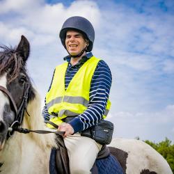 A man riding on the back of a horse