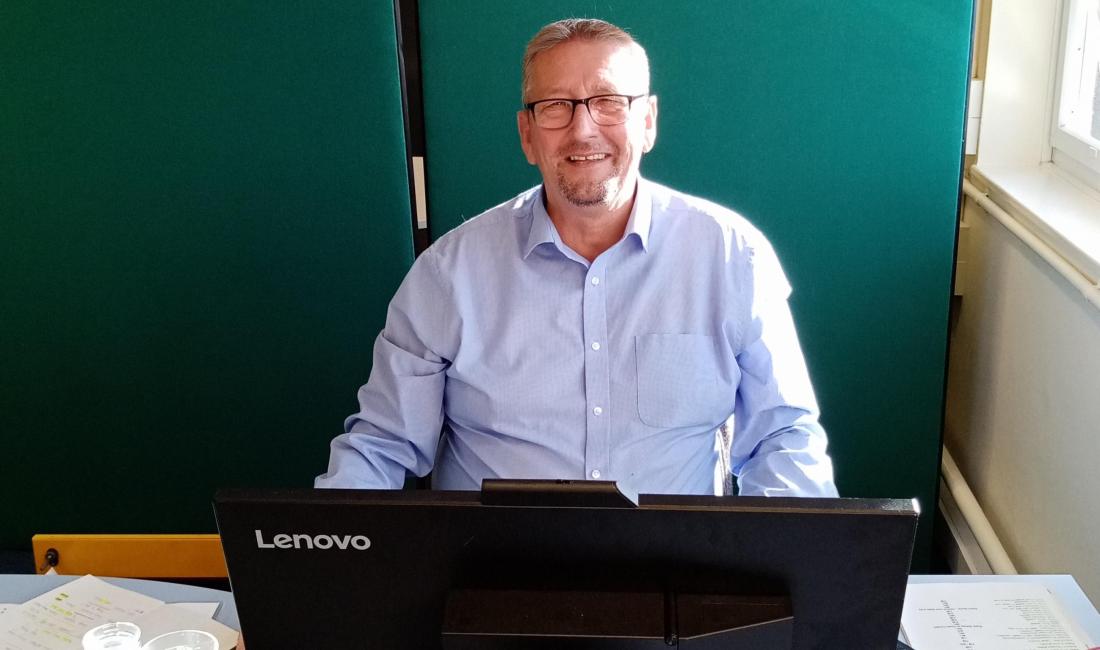 Gregor in the office smiling